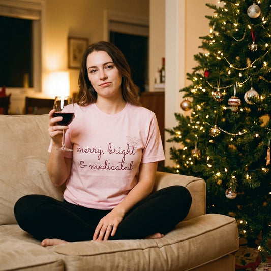 Merry Bright and Medicated Tee on the couch by the tree